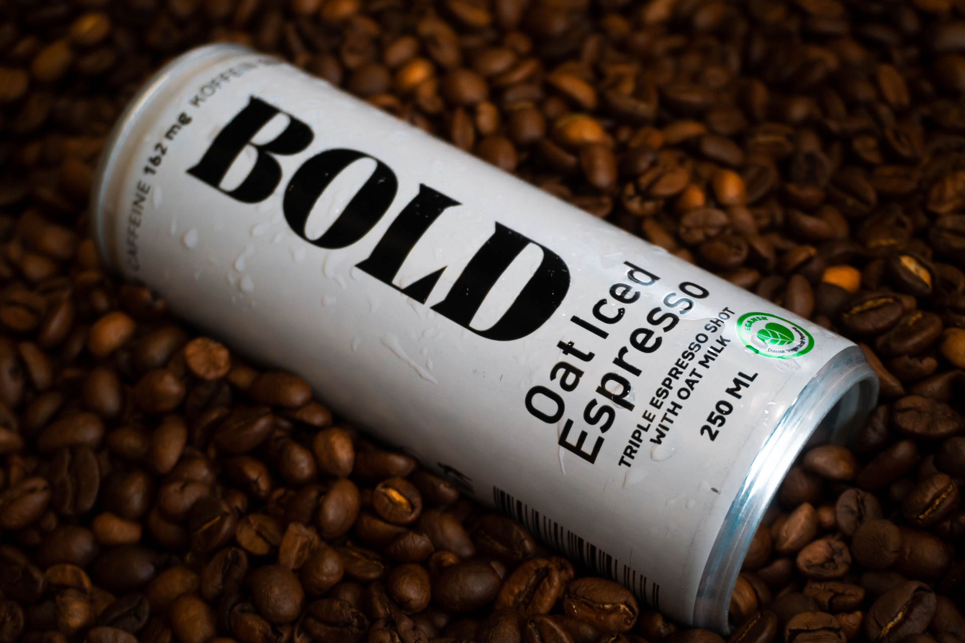 product image of ice coffee can on coffee beans